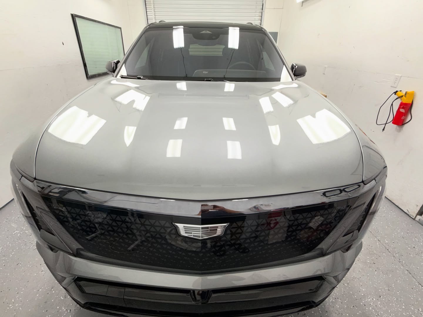 Cadillac with mirror finish after ceramic coating in MX Detail shop